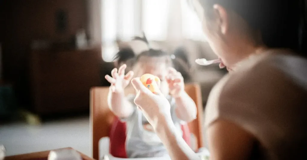 Child eating with mother