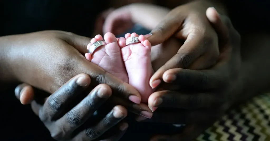 Holding baby feets