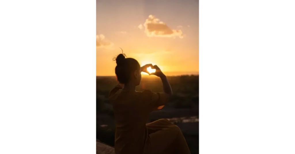Woman forming a heart with her hands