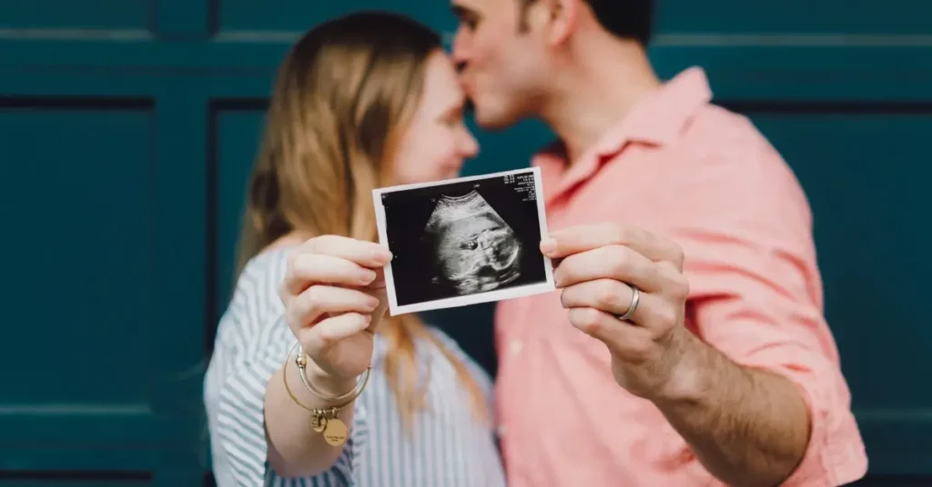 Parents holding ultra sonic picture