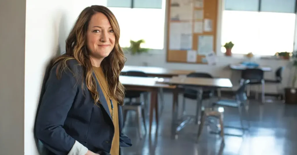 Female Teacher at an empty classroom